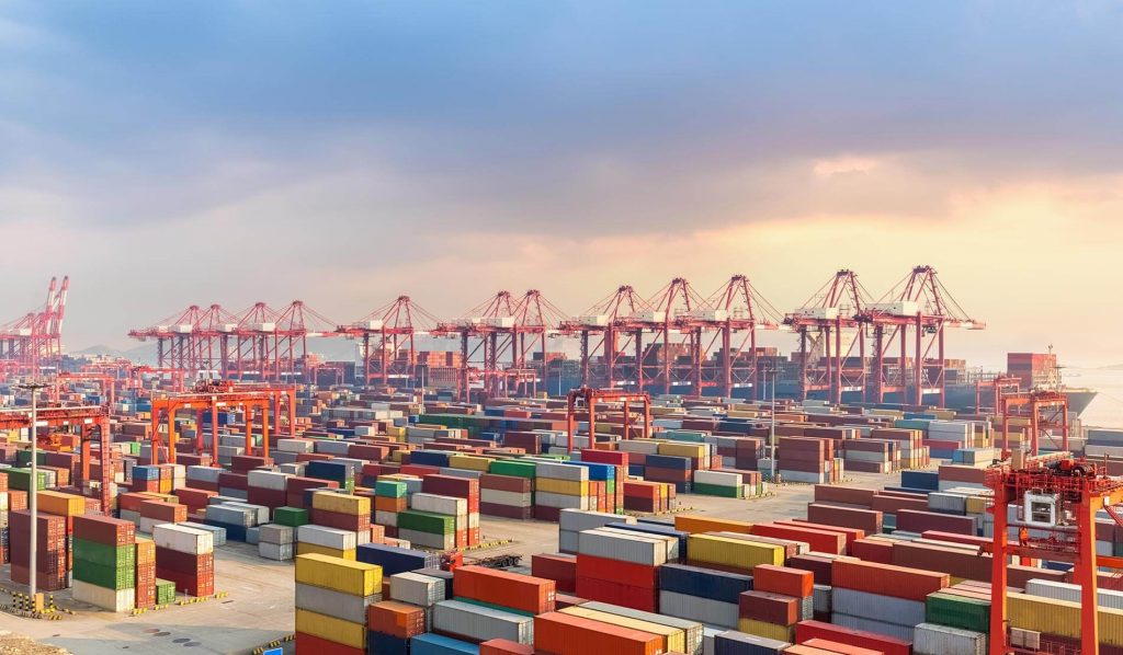 Crane rail systems in use at a busy dock