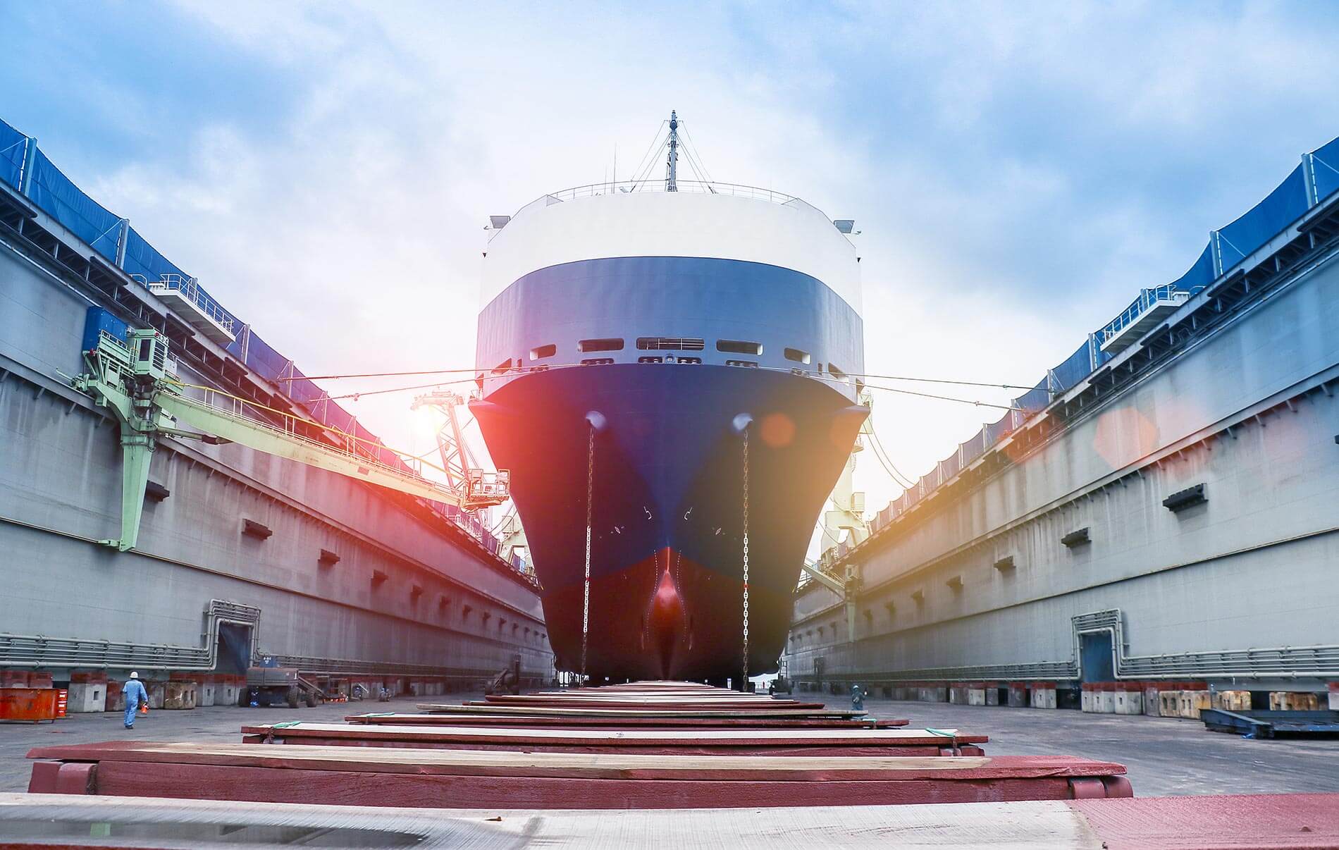 A shipyard with a huge ship docked